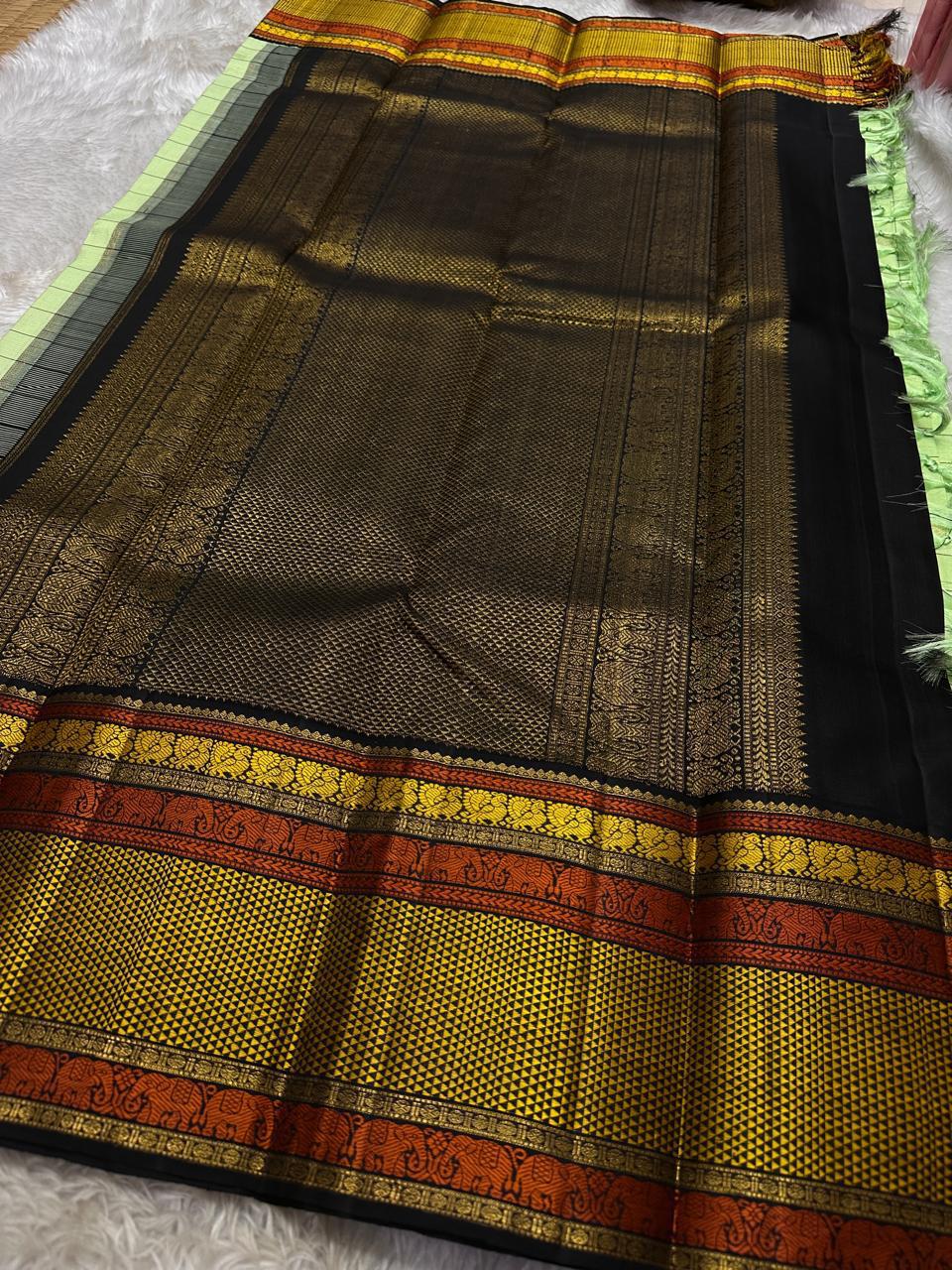 ✨ Elakkai Kattam — Pure Silk Kanchipuram Saree ✨
Cardamom-green body with black kattam checks and gold buttas, contrasted by kumkum-rust & kanak-gold borders with elephant zari and a rich black brocade pallu.
Silk Mark Certified ✅ • Fall & Pico Done ✅ •