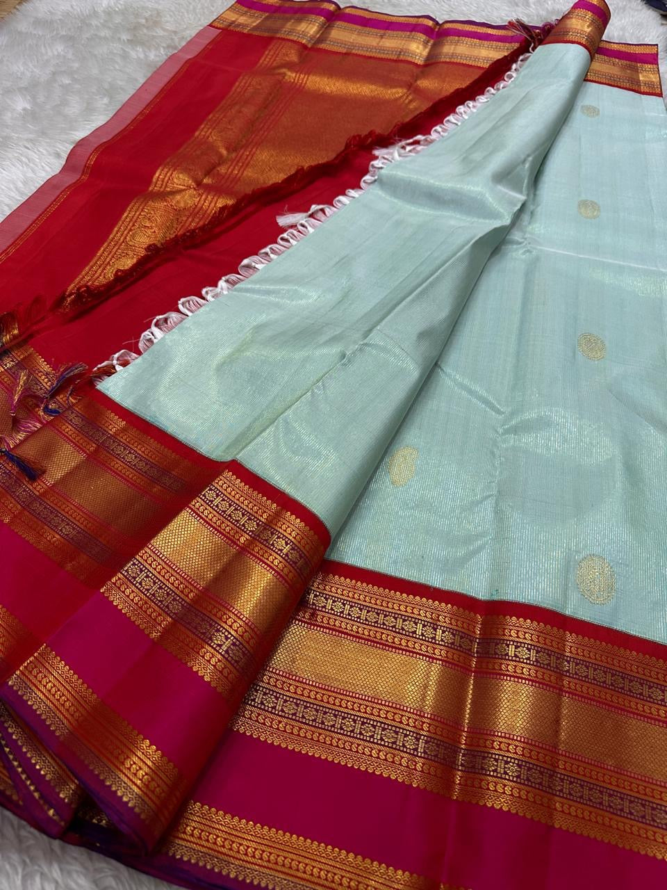 Sky Blue Vairaoosi — Pure Silk Kanchipuram Saree
Rani Pink Korvai Border & Red Brocade Pallu
Silk Mark Certified • Free USA Shipping • Ships in Two Weeks