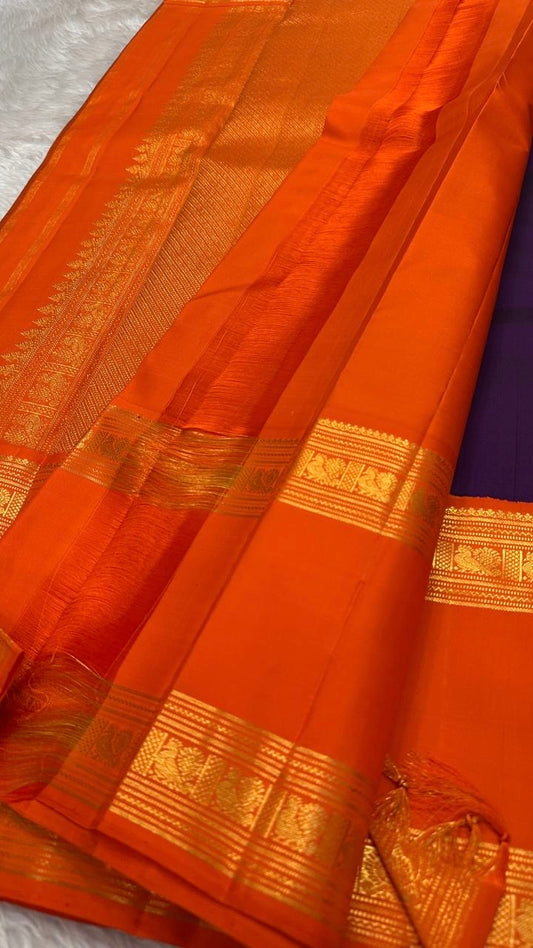 Pure silk kanchipuram handloom saree with purple body mayil floral butta orange border intricate pallu