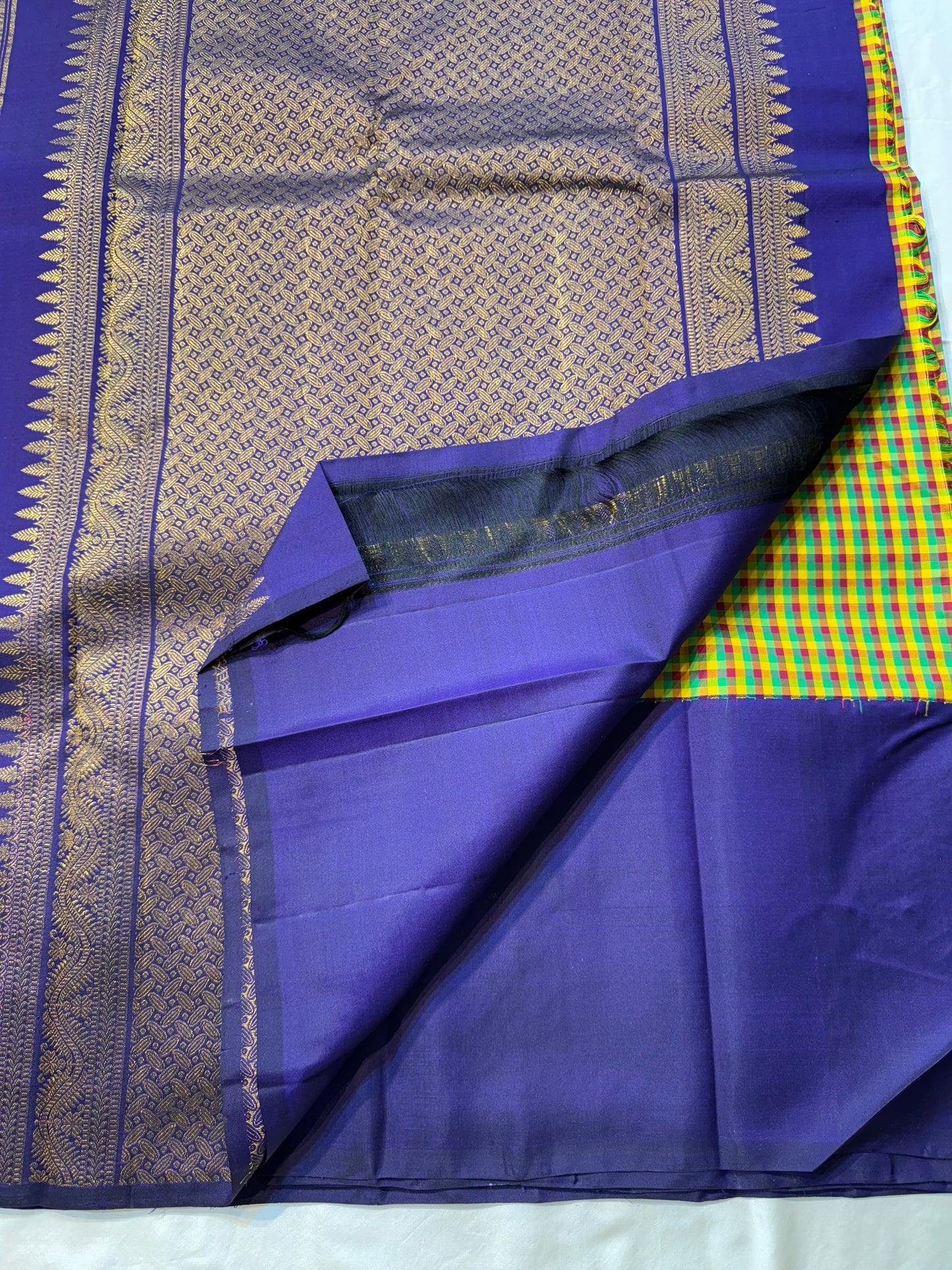 Vriksham ✨
Pure Kanchipuram Silk Saree in Multicolor Checks & Purple
kattam body in yellow, green, red & Rama blue
Royal purple border with zari Tree-of-Life & birds
Silk Mark Certified, delivery in 2 weeks