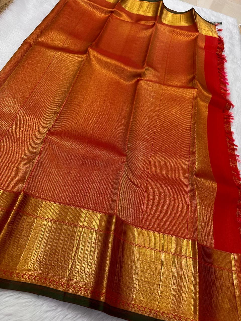 Kirtan ✨ – Vermilion Red Kanchipuram Pure Silk Saree
with Intricate Gold Zari Kattam Checks
Broad Lustrous Golden Border with Green Selvedge 🌿
Grand Radiant Pallu in Red & Gold Weaves
An Heirloom of Tradition, Festivity & Grace
