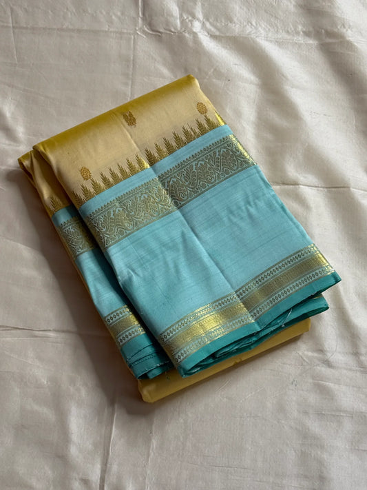 Body: pastel lemon-cream with tiny gold zari buttas
Borders/Pallu: sea-foam aqua with temple (reku) peaks & paisley vine zari
Silk Mark Certified • Free USA Shipping • Ships in Two Weeks