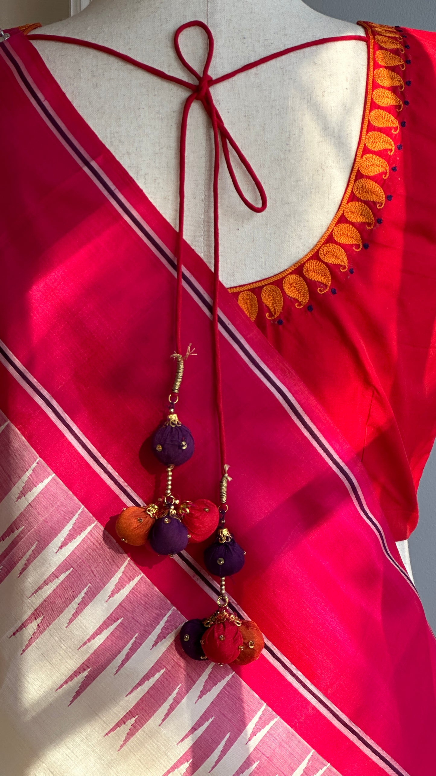 "shree" collection - pure silk embroidery blouse with chosen motifs in ikat silk orange red and purple