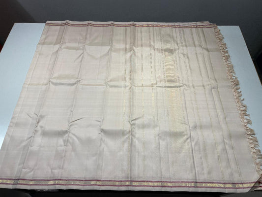 Minimal Kanjivaram silk saree in soft white grey tone with traditional zari slim border detail