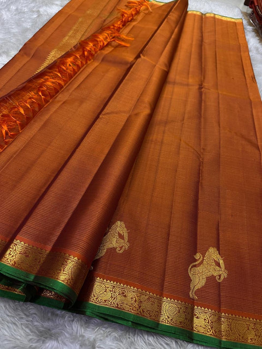 Rust Orange Yazhi Vairaoosi — Pure Silk Kanchipuram Saree
Rust orange body with fine vaira oosi lines and regal Yazhi zari motifs
Antique gold borders with green selvedge and grand brocade pallu ✨
Silk Mark Certified • Free USA Shipping • Ships in Two We