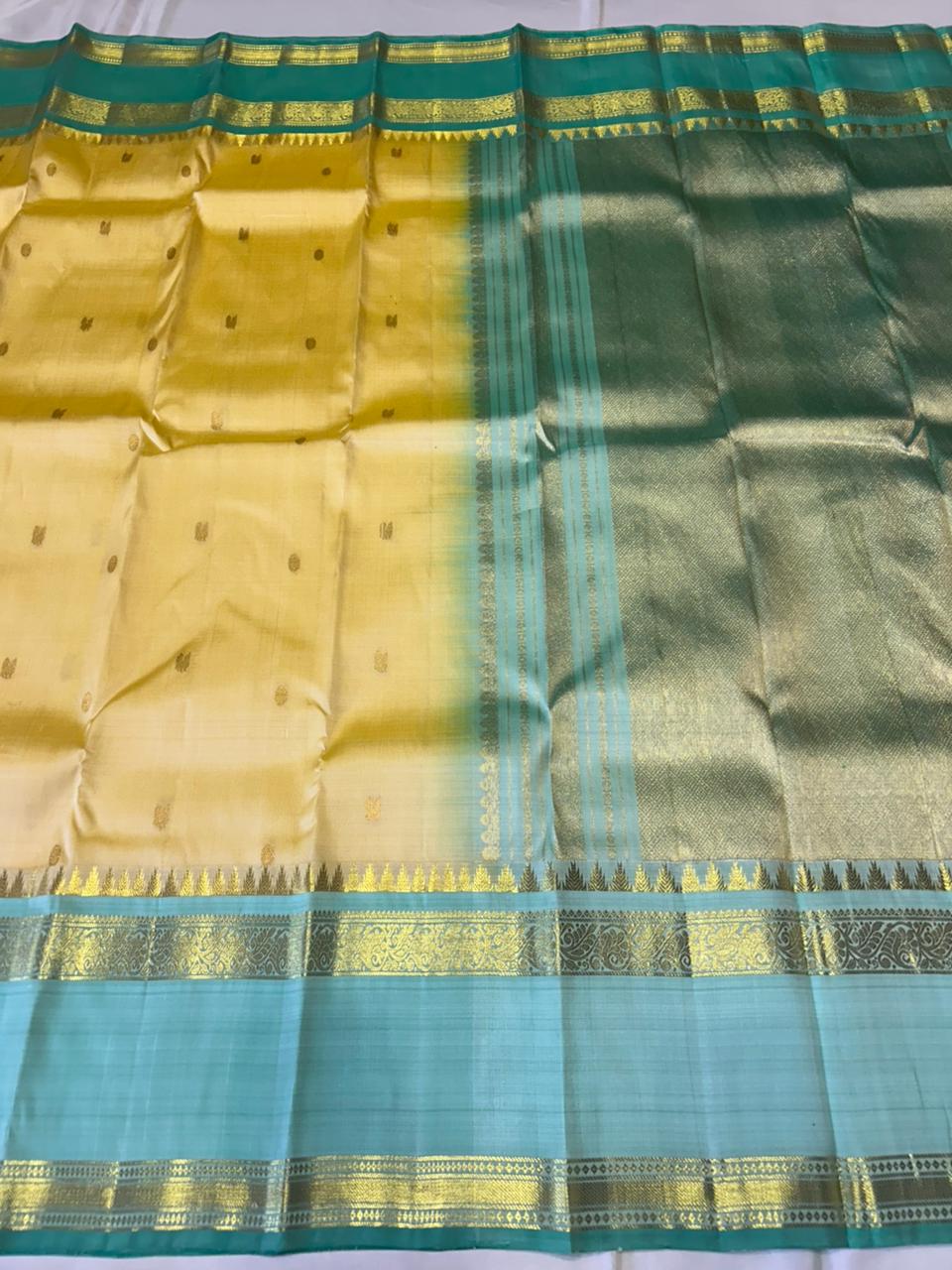 Sunlit Butter Yellow ✨ – Pure Kanchipuram Silk Saree in Butter Yellow & Sea Green with Gold Zari Temple Border & Grand Brocade Pallu – Silk Mark Certified, Fall & Pico Done, Blouse Stitching Available, ships in 2 weeks