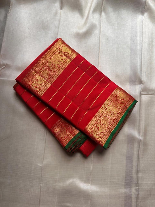 Aruna Kiran Red — Pure Silk Kanchipuram Saree
Crimson body with gold pinstripes, coin buttas & elephant zari borders
Silk Mark Certified • Free USA Shipping • Ships in Two Weeks