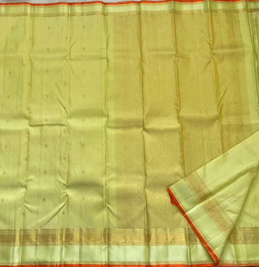 Meadow Shine — Kanchipuram Pure Silk Saree
Pastel meadow-green body with micro kattam checks & zari buttas
Antique zari borders woven with vine & elephant motifs
Warm kesari-orange selvedge a radiant edge . Silk mark cert. Free shipping within USA