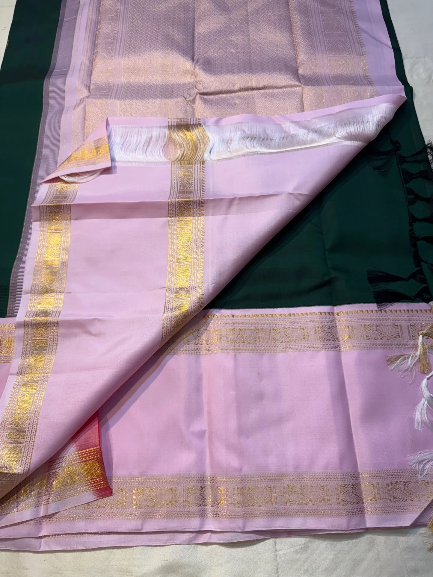 Harita Lavender — Pure Kanchipuram Silk Saree
Forest-green body with antique-gold rosette buttas, paired with lavender korvai borders in temple zari.
Grand lavender brocade pallu • Silk Mark Certified • Free USA Shipping • Ships in Two Weeks.