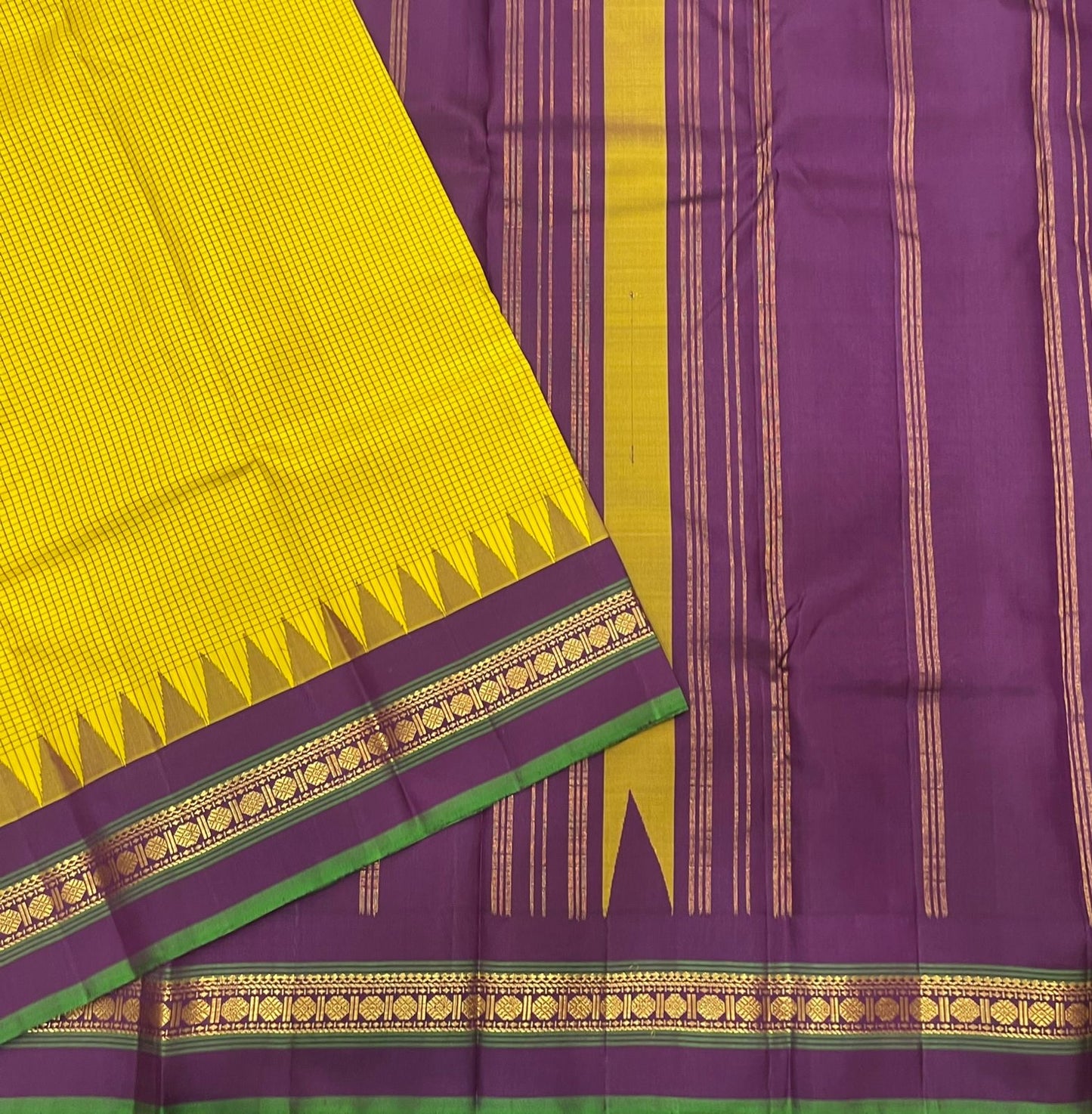 Ochre Turmeric Kattam
Pure Kanchipuram Silk Saree – Ochre Yellow Body with Fine Kattam Checks
Contrast Korvai Borders with Temple Serrations & Floral Zari
Grand Zari Brocade Pallu with Hand-Knotted Tassels
Silk Mark Certified ✅ |ships in 2 weeks