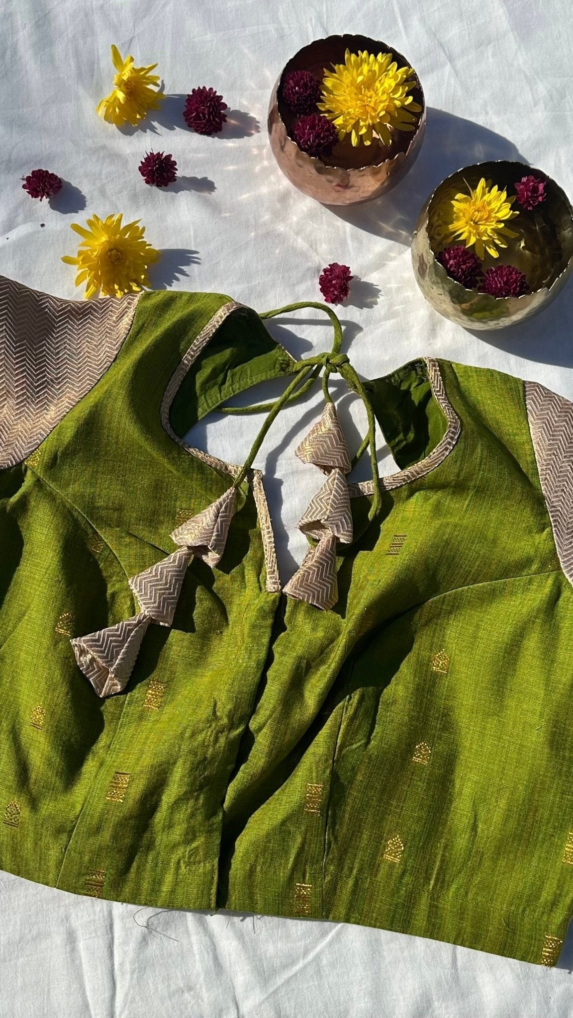 Parrot green and cream brocade blouse front view with woven motif detail