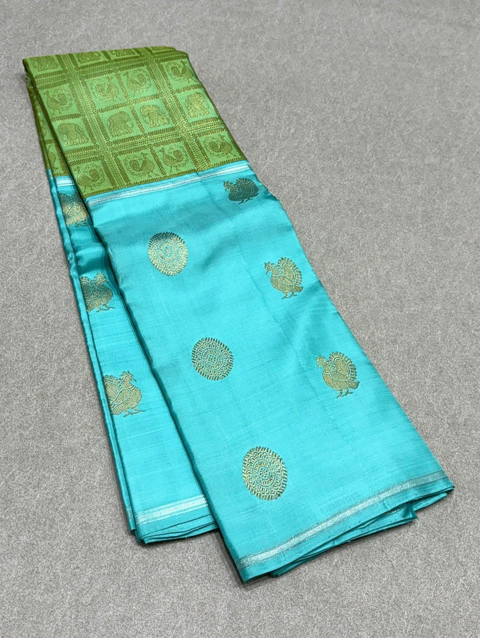 Aaral – Ice Blue & Spring Green Mubbagam Kanchipuram Pure Silk Saree with Mayil Chakram Buttas & Vanasringaram Grid Pallu