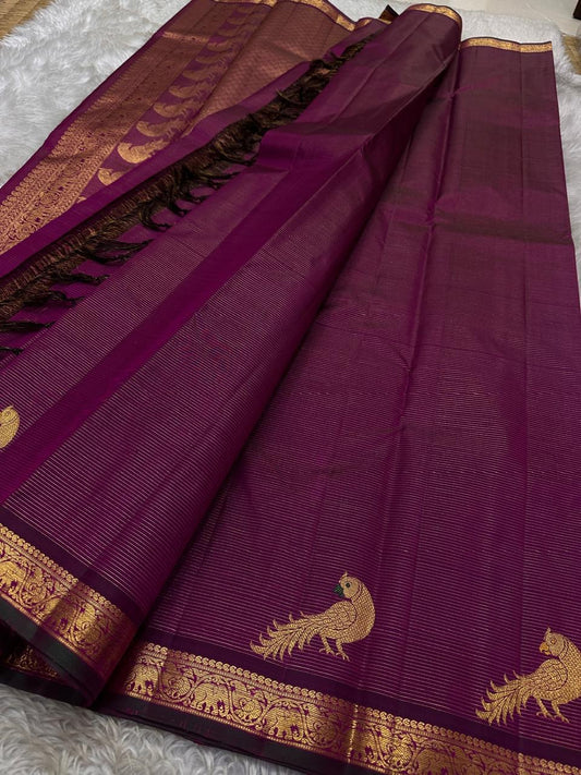 Purple Mayil Vairaoosi — Pure Silk Kanchipuram Saree
Royal purple body in fine vairaoosi pin-stripes with gold mayil motifs
Antique-gold zari borders, copper-rose brocade pallu & black selvedge ✨
Silk Mark Certified • Free USA Shipping • Ships in Two Week