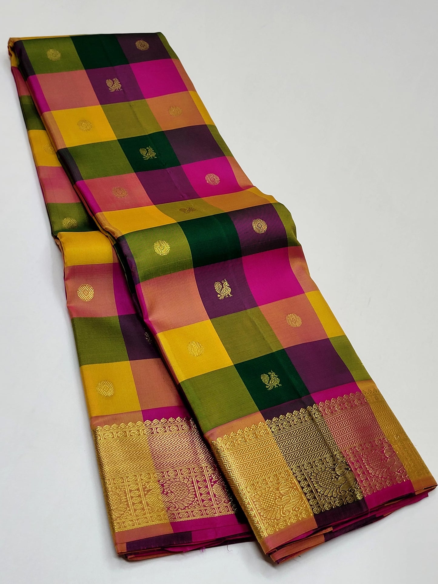 Sunset Mosaic – Paalum Pazhamum – Pure Kanchipuram Silk Saree
Vibrant Multicolored Checks in Yellow, Green, Rust & Maroon
Golden Zari Borders with Traditional Intricate Weaves
Silk Mark Certified, delivery in 2 weeks