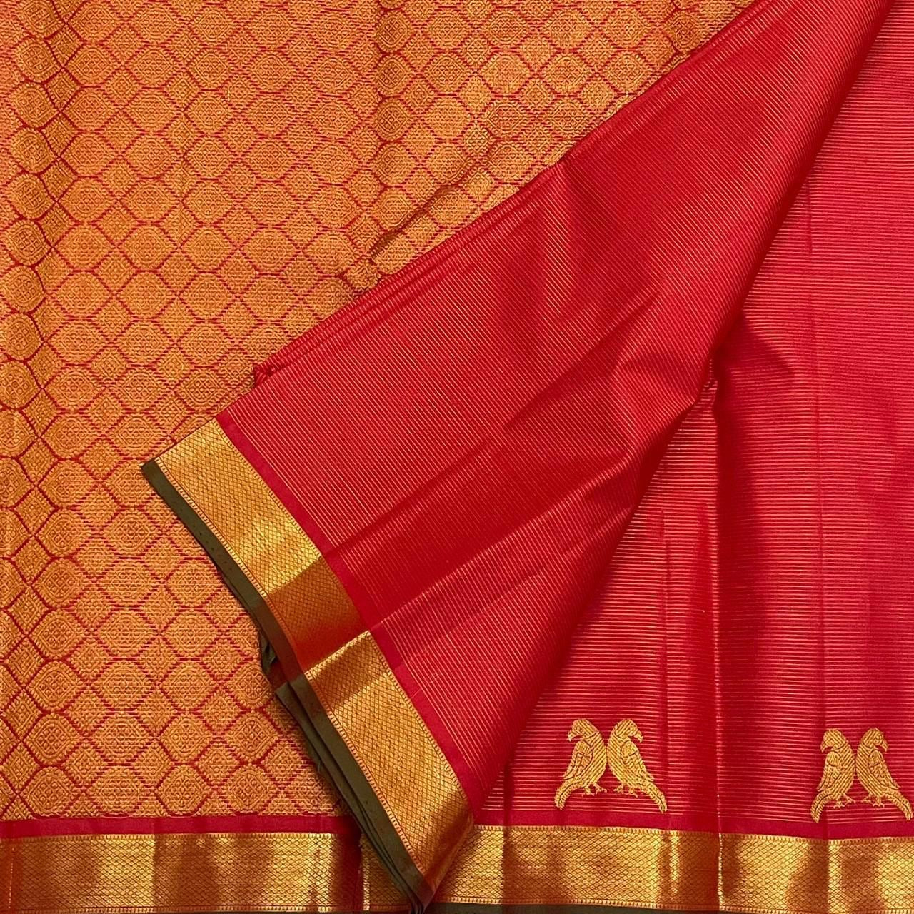 Sindoor Kili Vairaoosi — Pure Silk Kanchipuram Saree
Arakku-red body with twin parrot buttas and marigold-orange kasu jaal pallu
Silk Mark Certified • Ships in Two Weeks • Free Shipping within USA