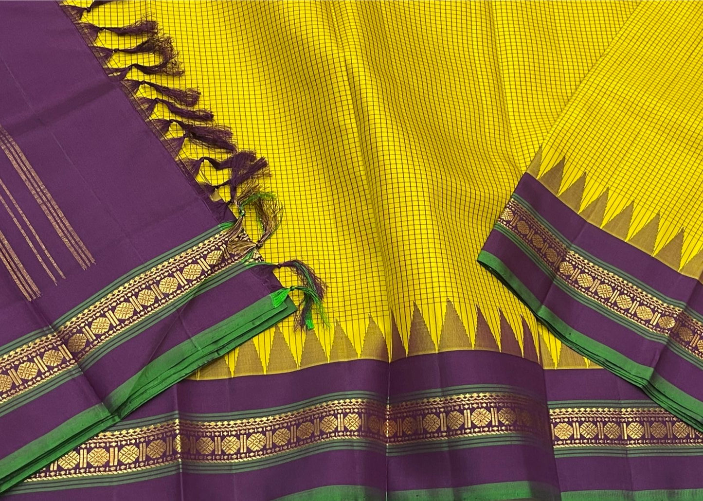 Ochre Turmeric Kattam
Pure Kanchipuram Silk Saree – Ochre Yellow Body with Fine Kattam Checks
Contrast Korvai Borders with Temple Serrations & Floral Zari
Grand Zari Brocade Pallu with Hand-Knotted Tassels
Silk Mark Certified ✅ |ships in 2 weeks