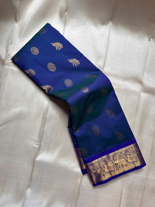 Neelam Light Weight – Budget Kanchipuram Silk (Light weight)blue body with gold zari gaja & medallion buttasRoyal blue border with peacock & floral zari detailingShips in two weeksSilk Mark Certified | Fall & Pico Done