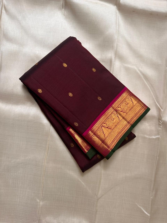 Berry Ruby Kamalam Butta — Pure Kanchipuram Silk
Lotus zari buttas on deep ruby silk with rani korvai border
Silk Mark Certified • Free Shipping within USA • Ships in Two Weeks