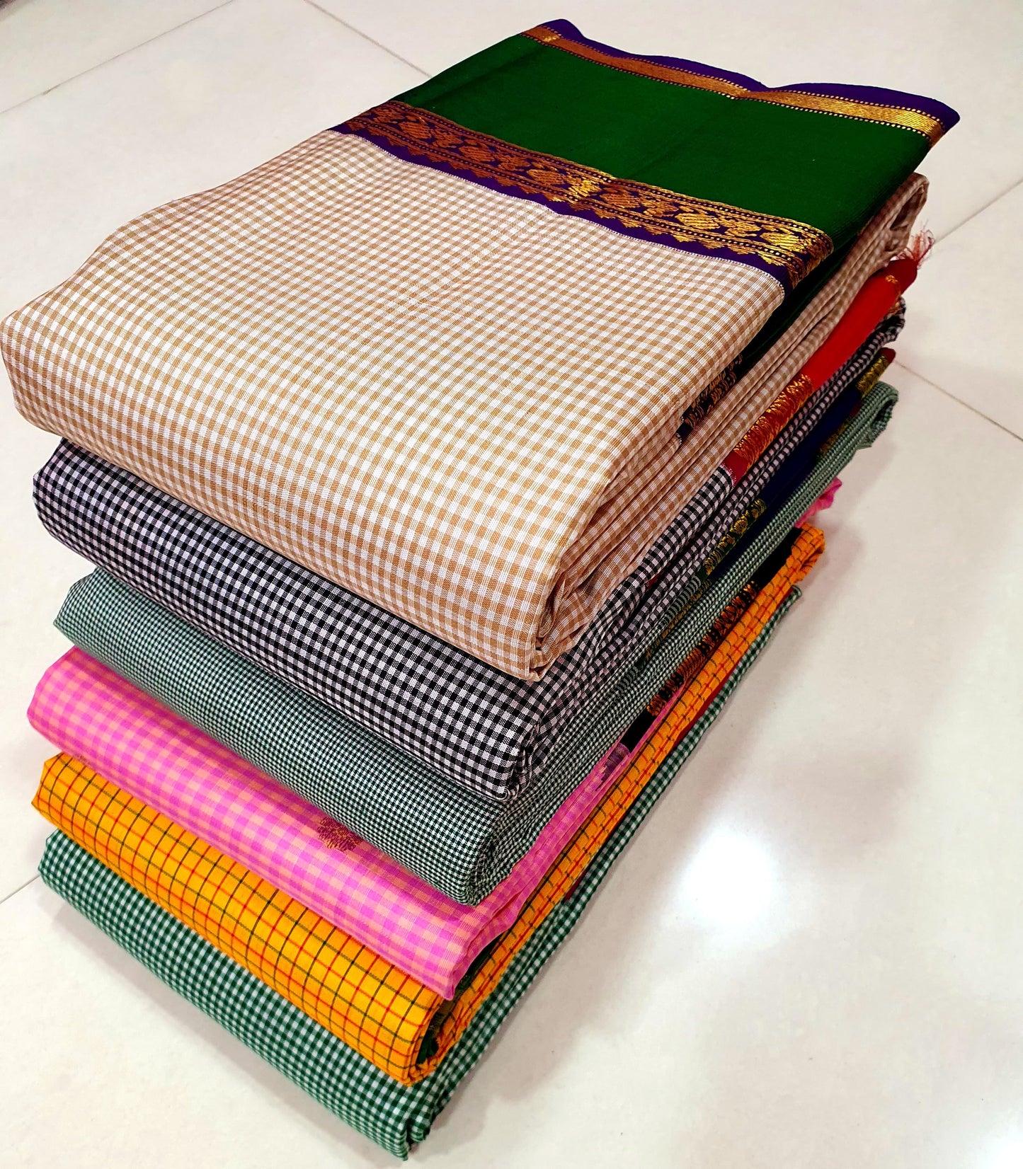 Rani Ember Podi Kattam – Pure Kanchipuram Silk Saree
Micro Black & Ivory Checks with Korvai Rani Magenta Border
Gold Zari Coin & Floral Vine Detailing with Vermilion Selvedge
Rich Rani Magenta Zari-Striped Pallu |
Silk Mark , free shipping within 2 weeks