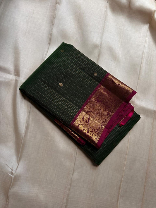 Hemavalli Zari Kattam: Stunning Emerald Green & Rani Pink Korvai Pure Silk Kanchipuram with Gold Zari Checks
Silk Mark Certified for Quality Assurance, Enjoy Free Shipping within USA.
Ready to Ship in 2 Weeks with Majestic Peacock Borders.