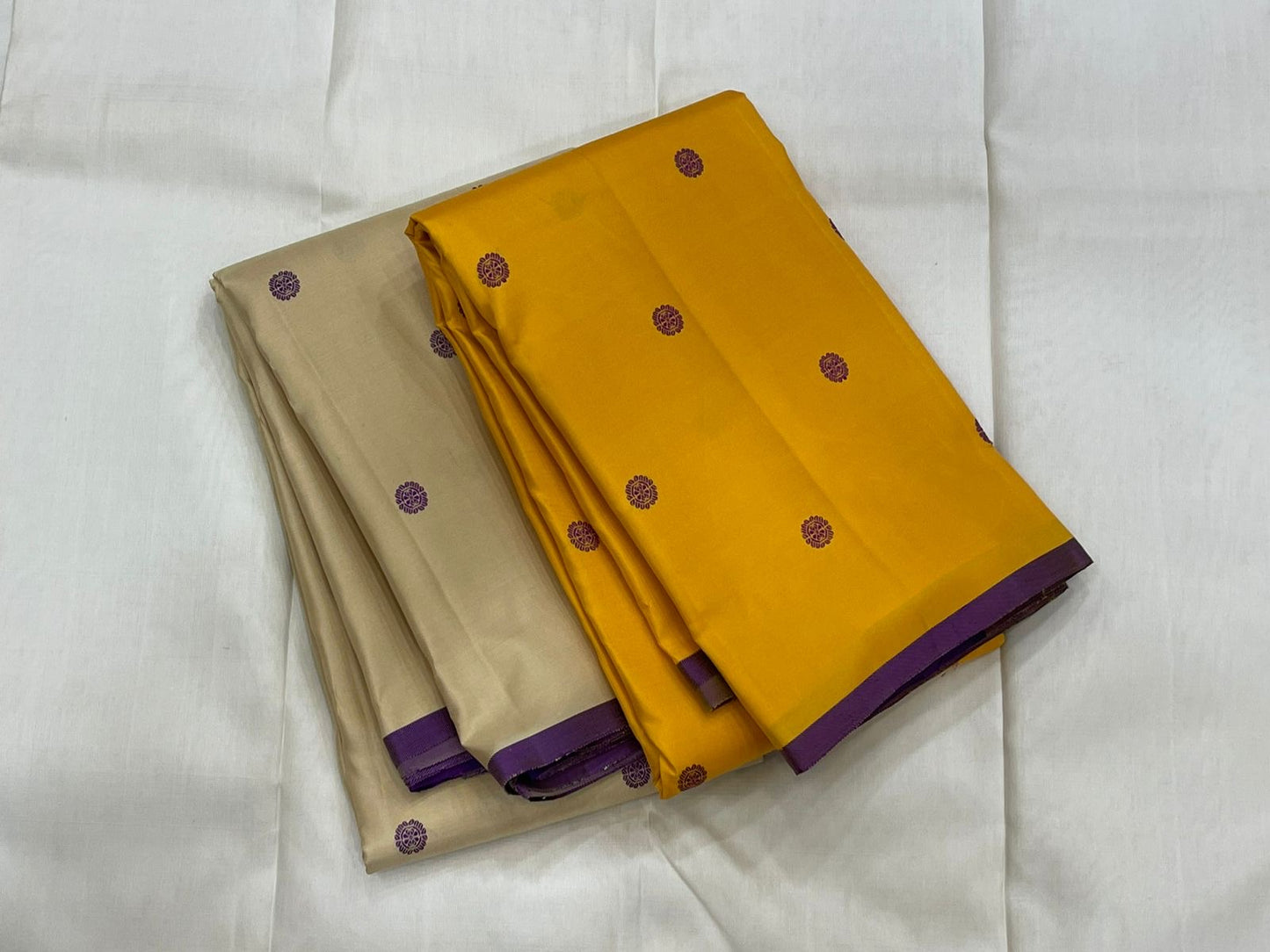 Paal Vadamalli Chakram – Pure Kanchipuram Silk Saree
Ivory body with royal-purple floral coin thread buttas
Grand purple pallu with zari panels & striped center
Handloom Double Warp Weave | Silk Mark Certified | Fall & Pico Done
Free shipping