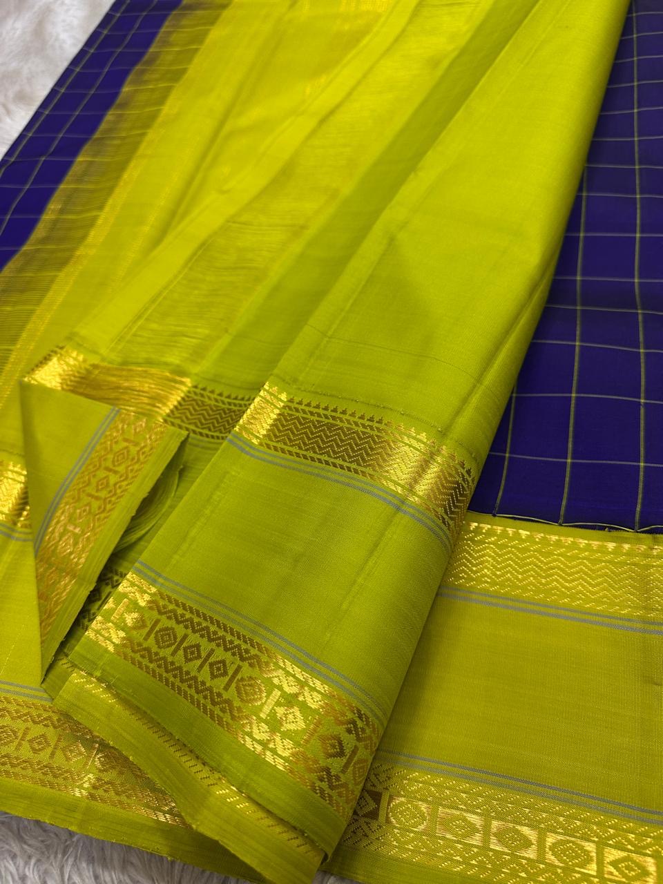 Neelam Parrot Pachai — Pure Kanchipuram Silk Saree
Royal blue body with gold kattam checks & parrot-green korvai border
Silk Mark Certified ✅ | Free USA Shipping | Ships in Two Weeks ✅