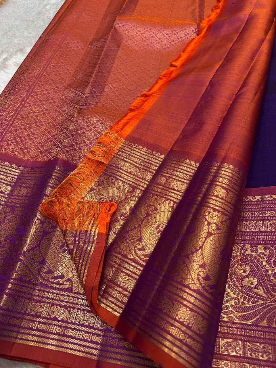 Royal purple and orange red double shade shot color Pallu pure silk Kanchipuram with ornate border featuring Peacock motifs