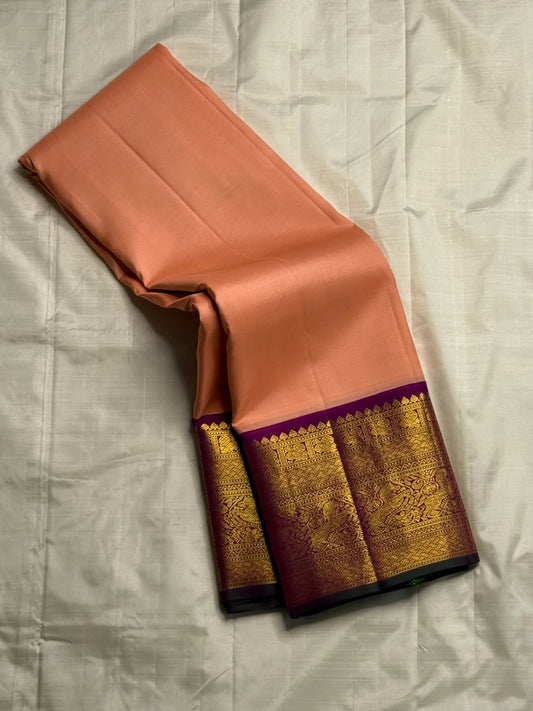 Apricot Yazhi — Pure Silk Kanchipuram Saree
Soft apricot-peach body with royal-purple korvai border featuring antique-gold Yazhi & Mayil motifs and temple edges.
Silk Mark Certified • Blouse Stitching ($30) • Free USA Shipping • Ships in 2 Weeks