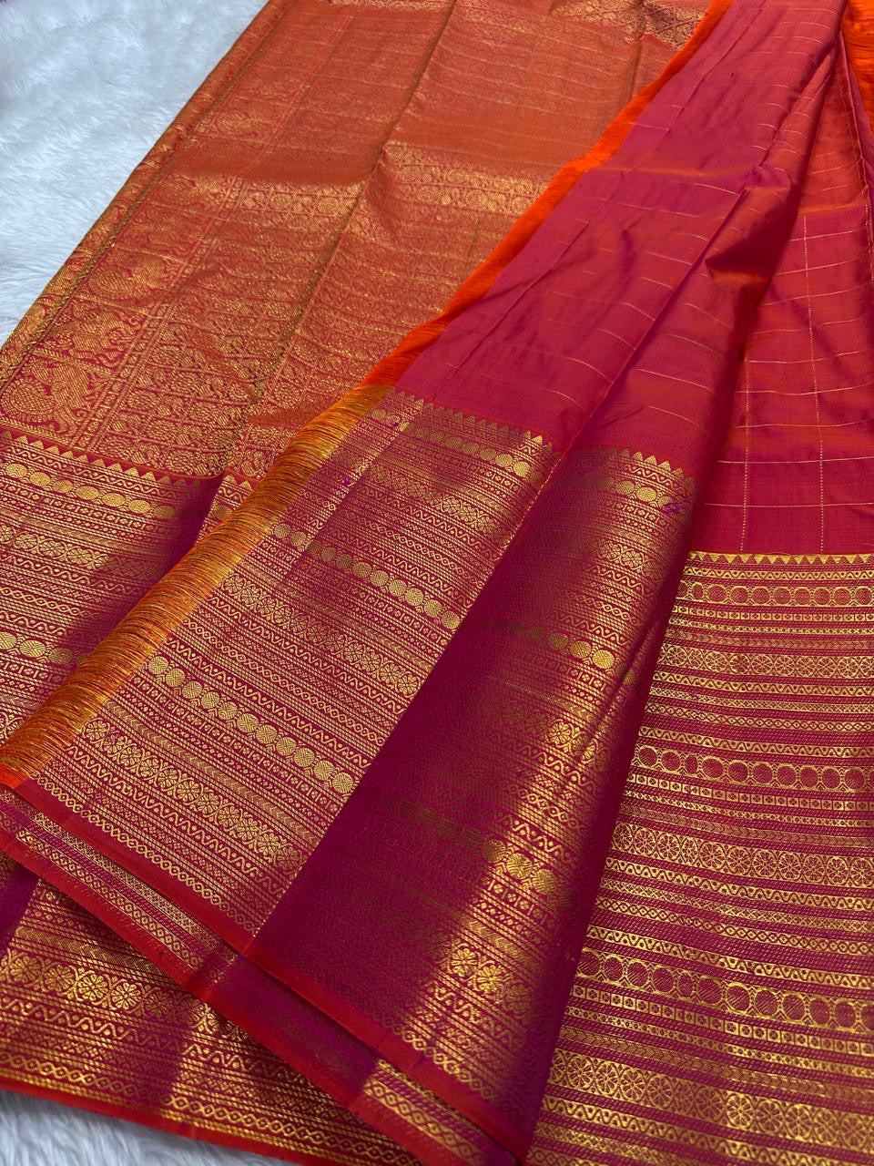 Orange red shot Zari kattam with ornate border pure silk Kanchipuram with mayil chakram zari butta and detailed Pallu