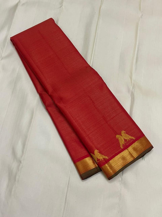 Sindoor Kili Vairaoosi — Pure Silk Kanchipuram Saree
Arakku-red body with twin parrot buttas and marigold-orange kasu jaal pallu
Silk Mark Certified • Ships in Two Weeks • Free Shipping within USA