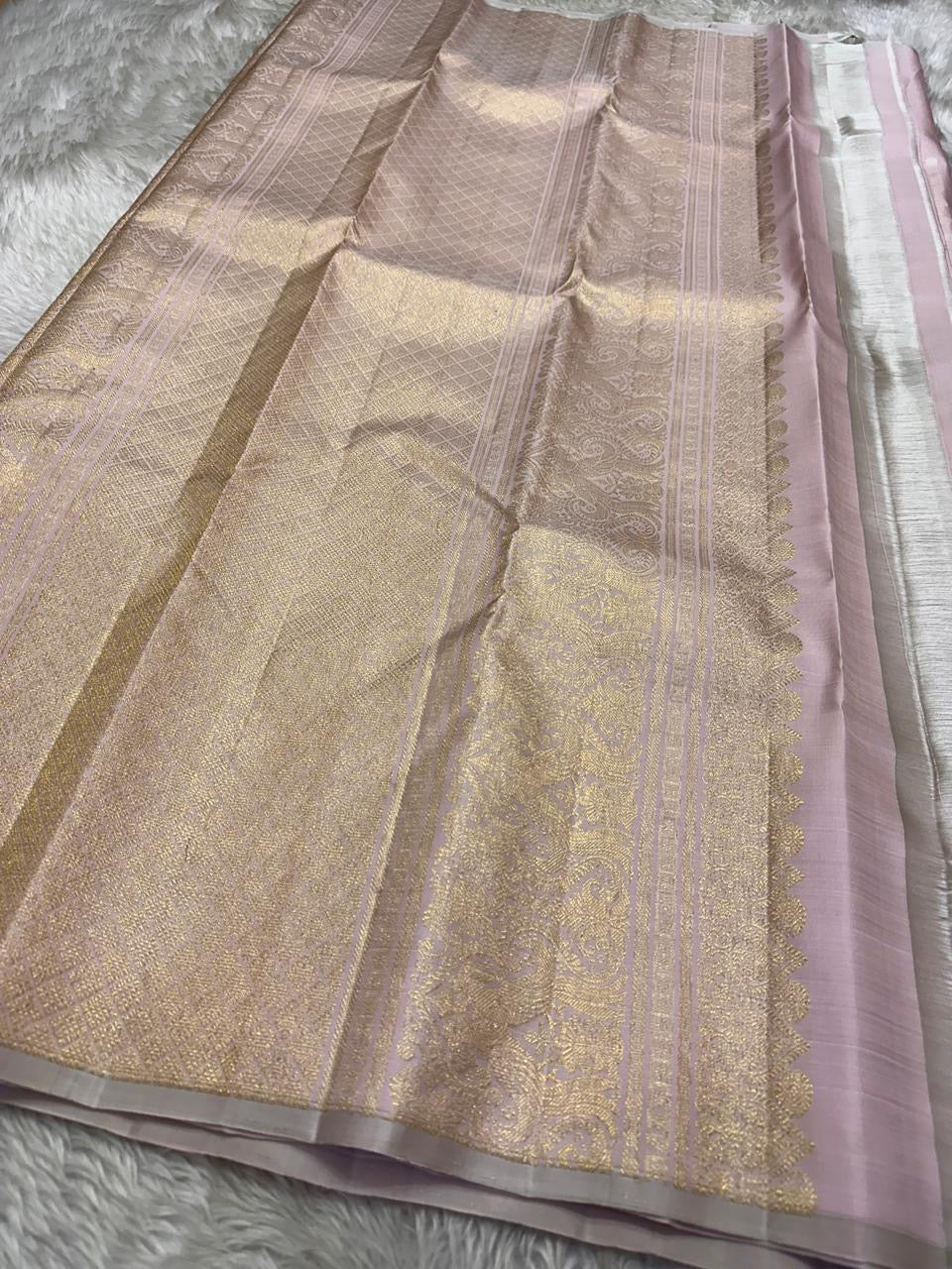 The daintiest blush pink with zari coin buttas in gold and silver pure silk Kanchipuram saree