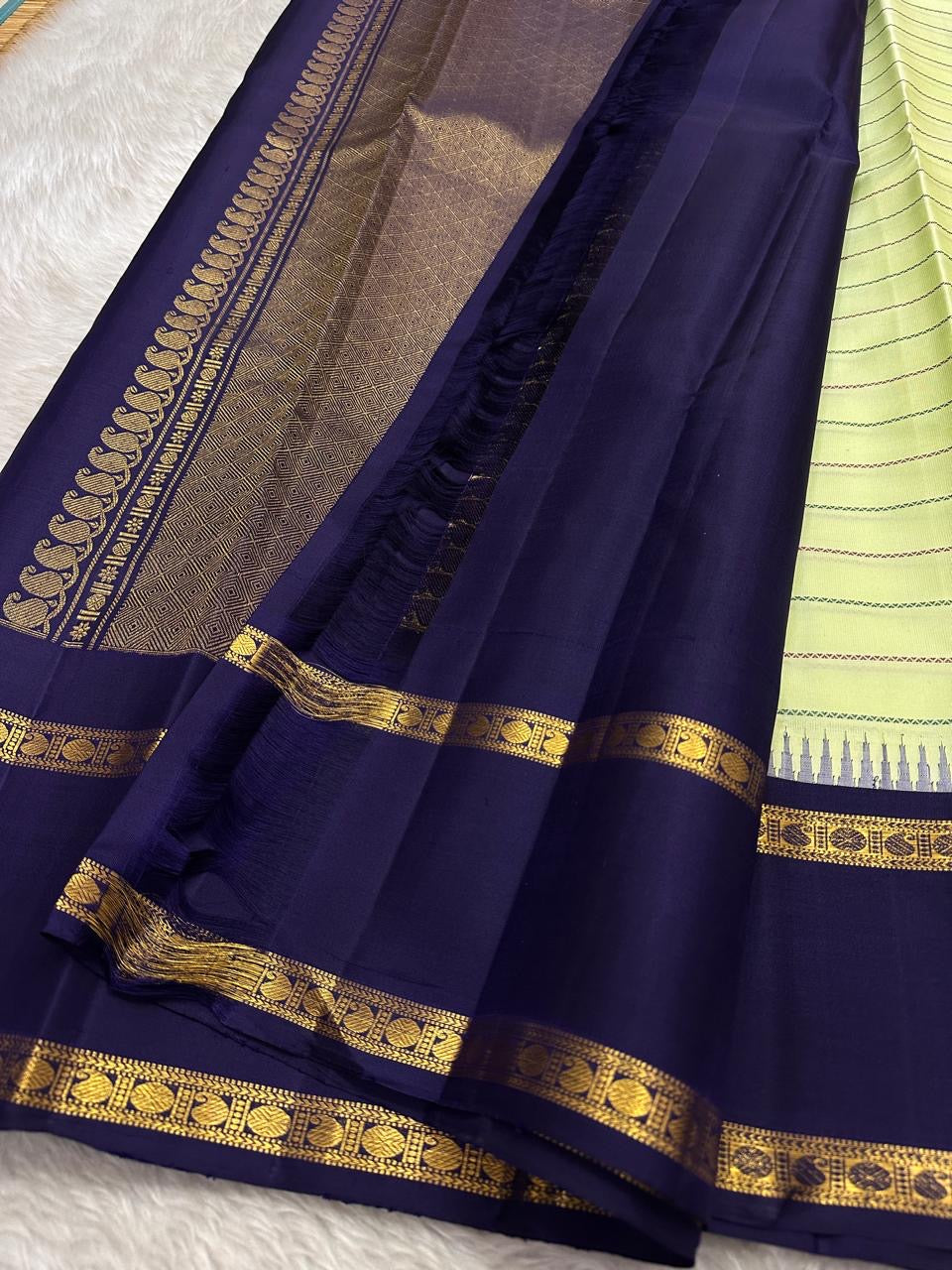 Cardamom veldhari Stripes – Pure Silk Kanchipuram Saree
Refreshing Cardamom Green Body with Stripes 🌿
Deep Purple Contrast Border in Rich Zari Weave ✨
Temple Motif Edging & Grand Lattice Pallu
Silk Mark Certified | ships two weeks
