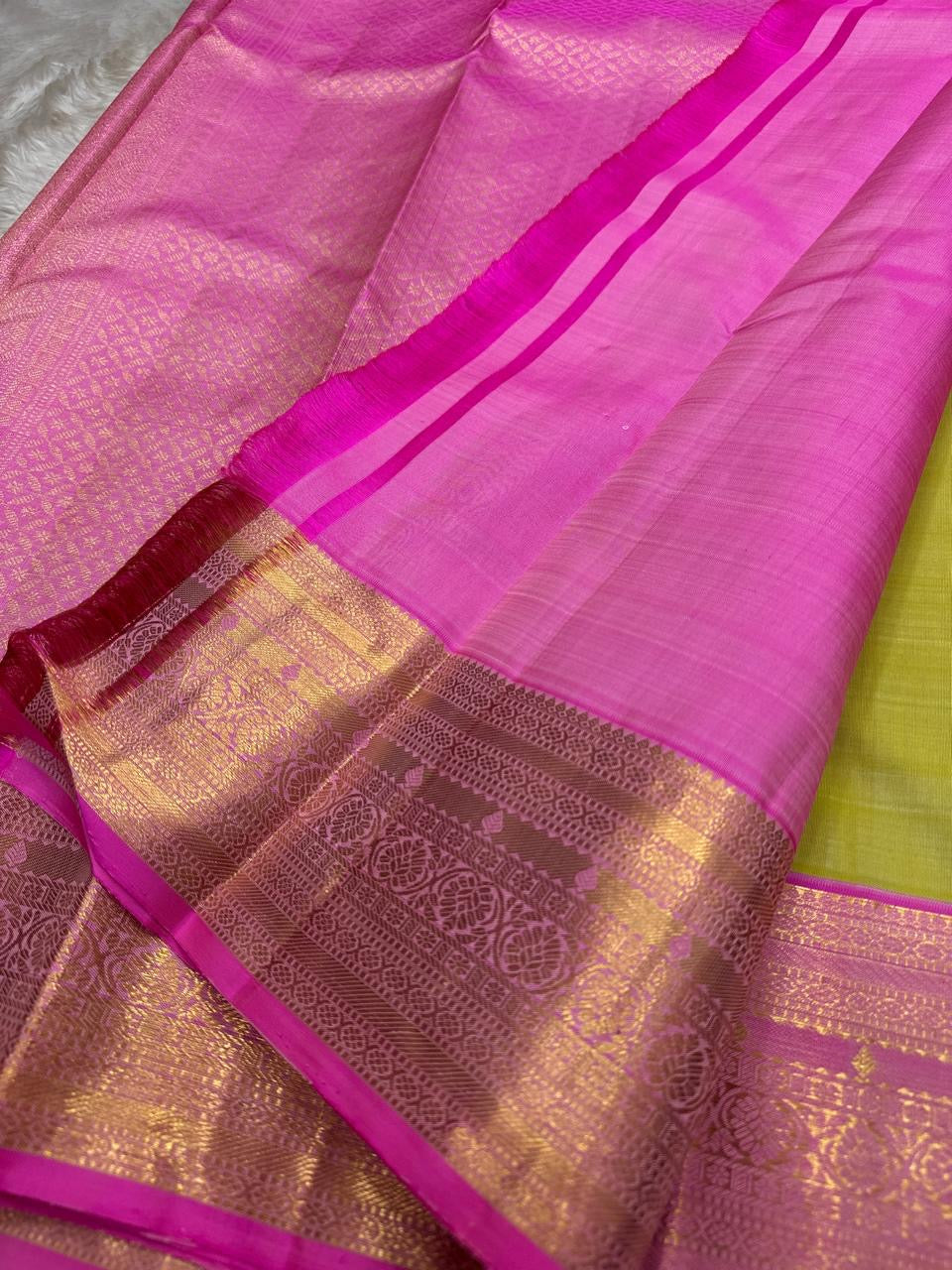 Lotus Lime Kanchipuram silk saree with lime-green body, rani pink korvai border, and grand zari brocade pallu. Silk Mark Certified. Free USA Shipping. Ships in two weeks.