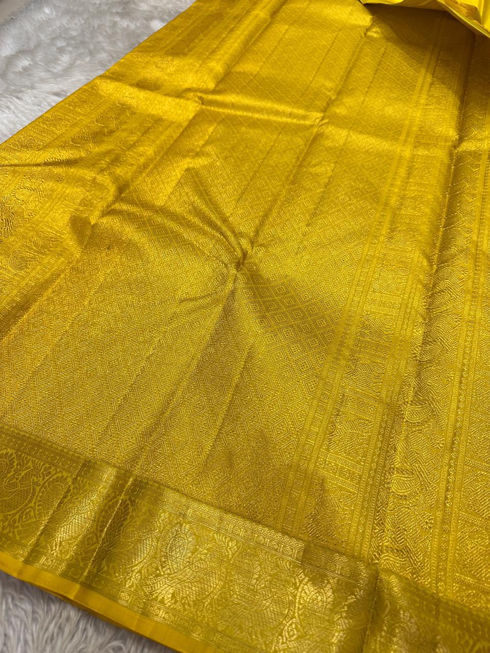 ✨ Maragatha Manjal — Pure Silk Kanchipuram Saree ✨
Radiant turmeric–marigold yellow with gold zari coin & floral buttas, peacock–paisley border & grand brocade pallu.
Silk Mark Certified • Free USA Shipping • Ships in 2 Weeks • Blouse Stitching $30 ✅