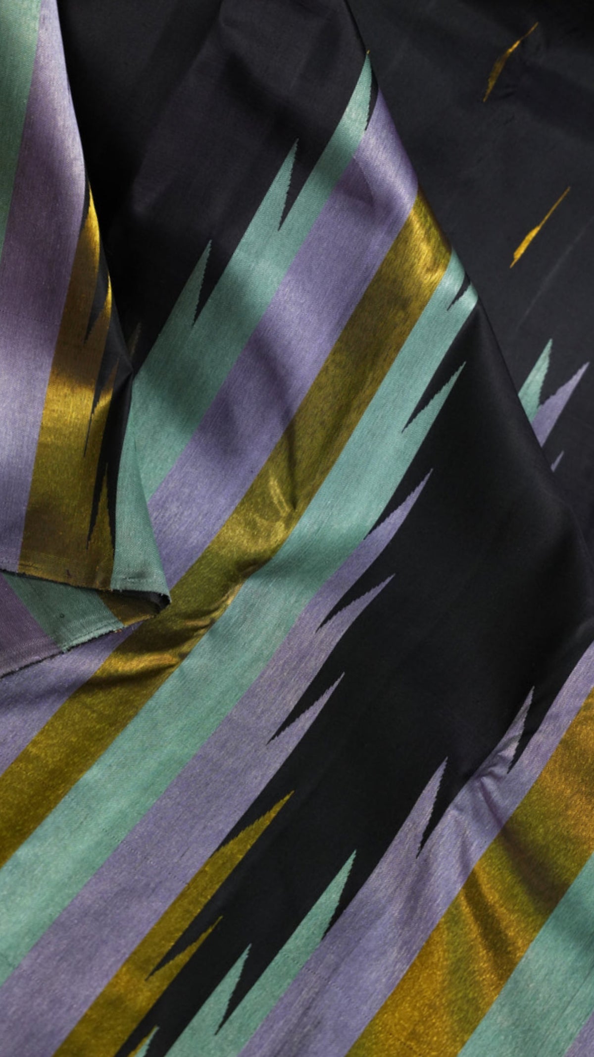Black Pure Silk Ettukol saree with densely woven handloom texture and quiet pastel colour variation.