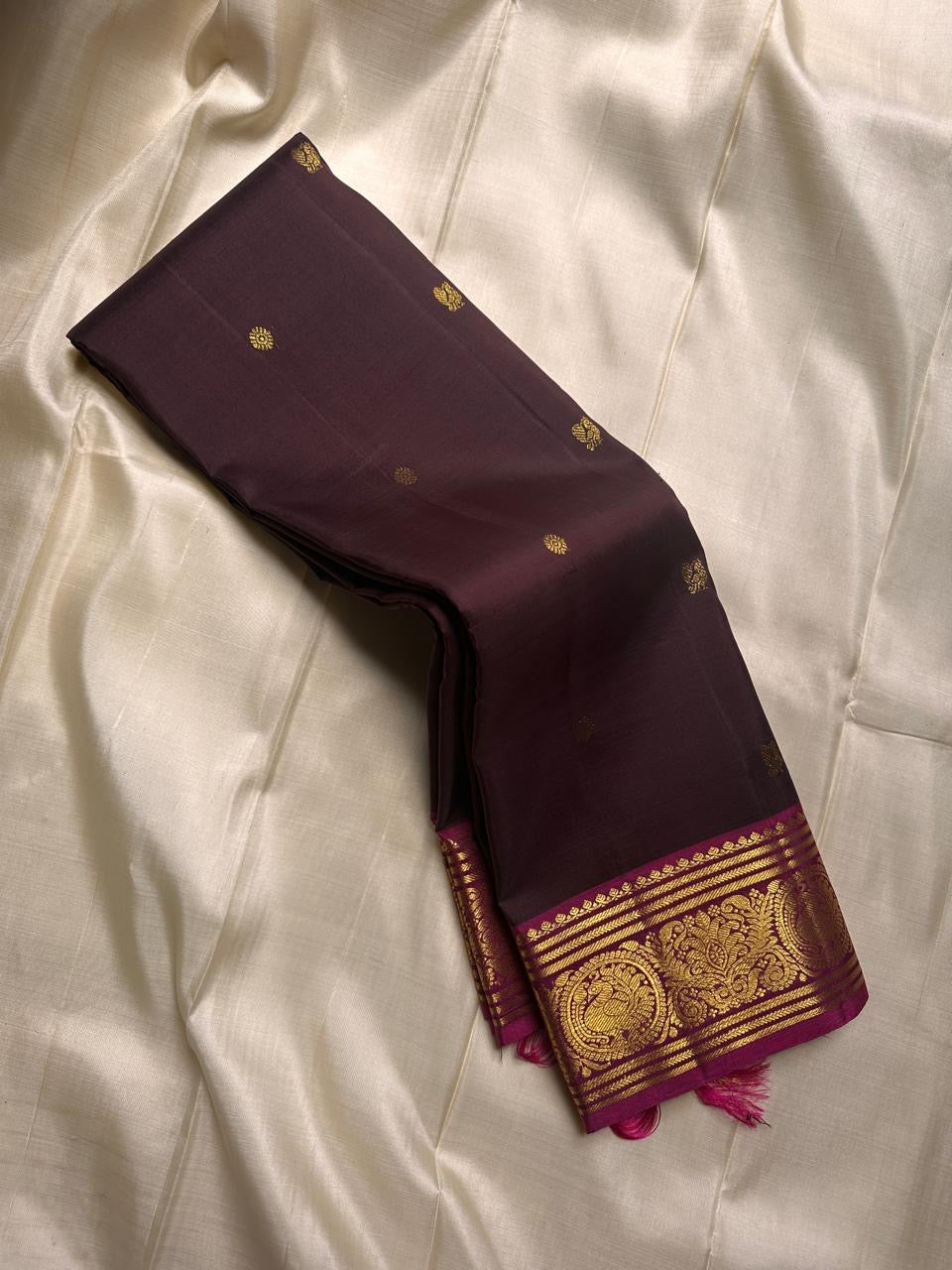 deep coffee brown silk stirred gently with a bold magenta border- rich drape pure silk mayil chakram butta saree