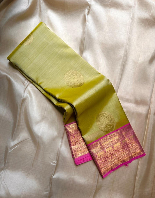 Lotus Lime Kanchipuram silk saree with lime-green body, rani pink korvai border, and grand zari brocade pallu. Silk Mark Certified. Free USA Shipping. Ships in two weeks.