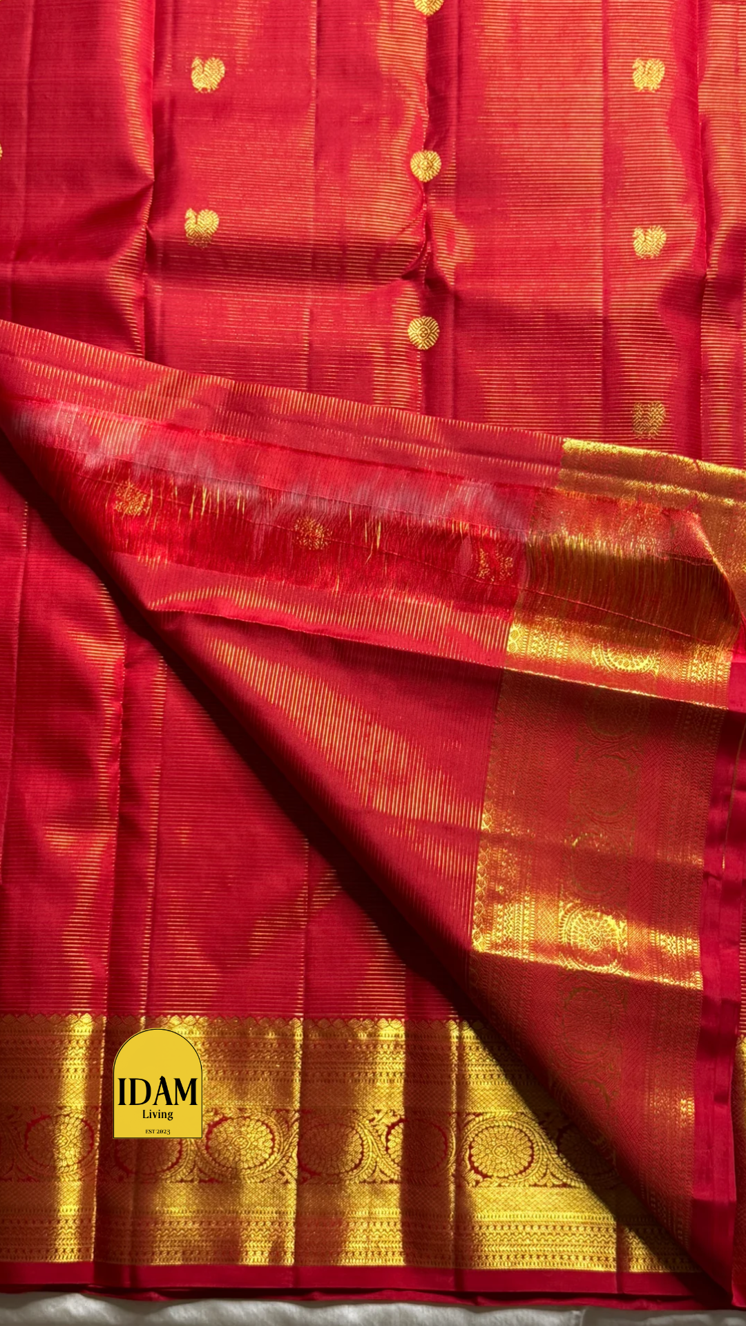 Nakshatra – Radiant Red Vairaoosi Kanchipuram Silk Saree Adorned with Mayil & Chakram Zari Buttas, Featuring an Ornate Kamalam and Floral Vine Zari Border, Flanked by Varisaipet Motifs, and a Pallu Woven with Sacred Thulasi Madams and Regal Kamalams