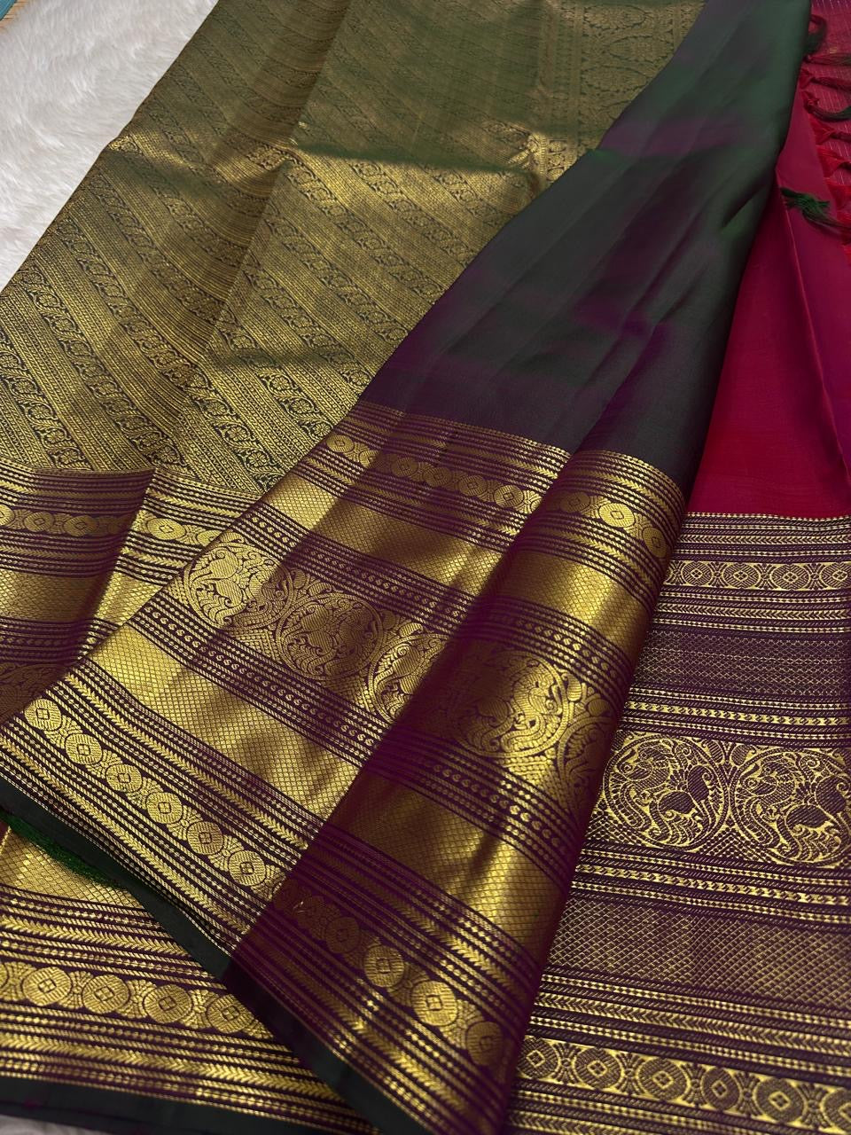 Red pure silk Kanchipuram with vertical zari stripes parrot motif varisaipet border with shot of green red Pallu