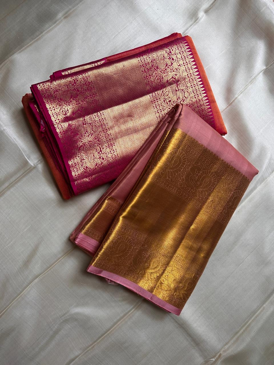 Vairaoosi - silk Kanchipuram thanga velli ( sonaroopa) zari butta in a mesmerizing rust red korvai getti (thick ) zari border with mayil motif