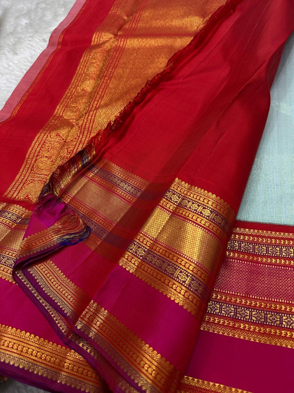 Sky Blue Vairaoosi — Pure Silk Kanchipuram Saree
Rani Pink Korvai Border & Red Brocade Pallu
Silk Mark Certified • Free USA Shipping • Ships in Two Weeks
