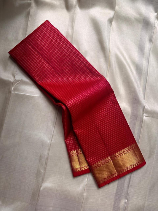 Madhuvanam Vermillion Red – Pure Silk Kanchipuram Saree
Rich vermillion red kattam checks with lustrous gold zari borders and brocaded pallu ✨
Silk Mark Certified • Ships in Two Weeks • Free Shipping within USA 🎁