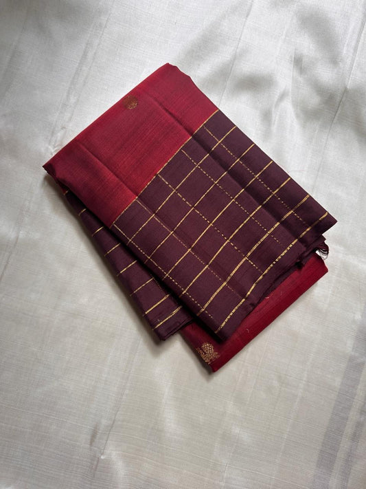 Poornima Kalyani
Kungumam Red & Cocoa Kanchipuram Silk Saree
Zari Buttas · Grid Borders · Silk Mark Certified