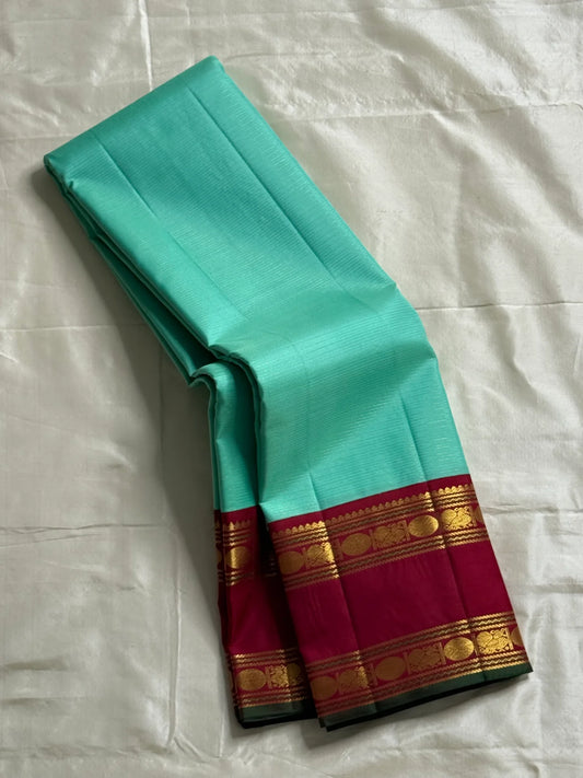 Neer Pachai Vairaoosi — Kanchipuram Pure Silk saree 
Sea-foam/aqua body with classic Vairaoosi pinstripes
Contrast ruby-maroon korvai borders with gold chakram & floral panels
Grand maroon pallu with all-over chakram jaal and paisley vines; aqua tassel