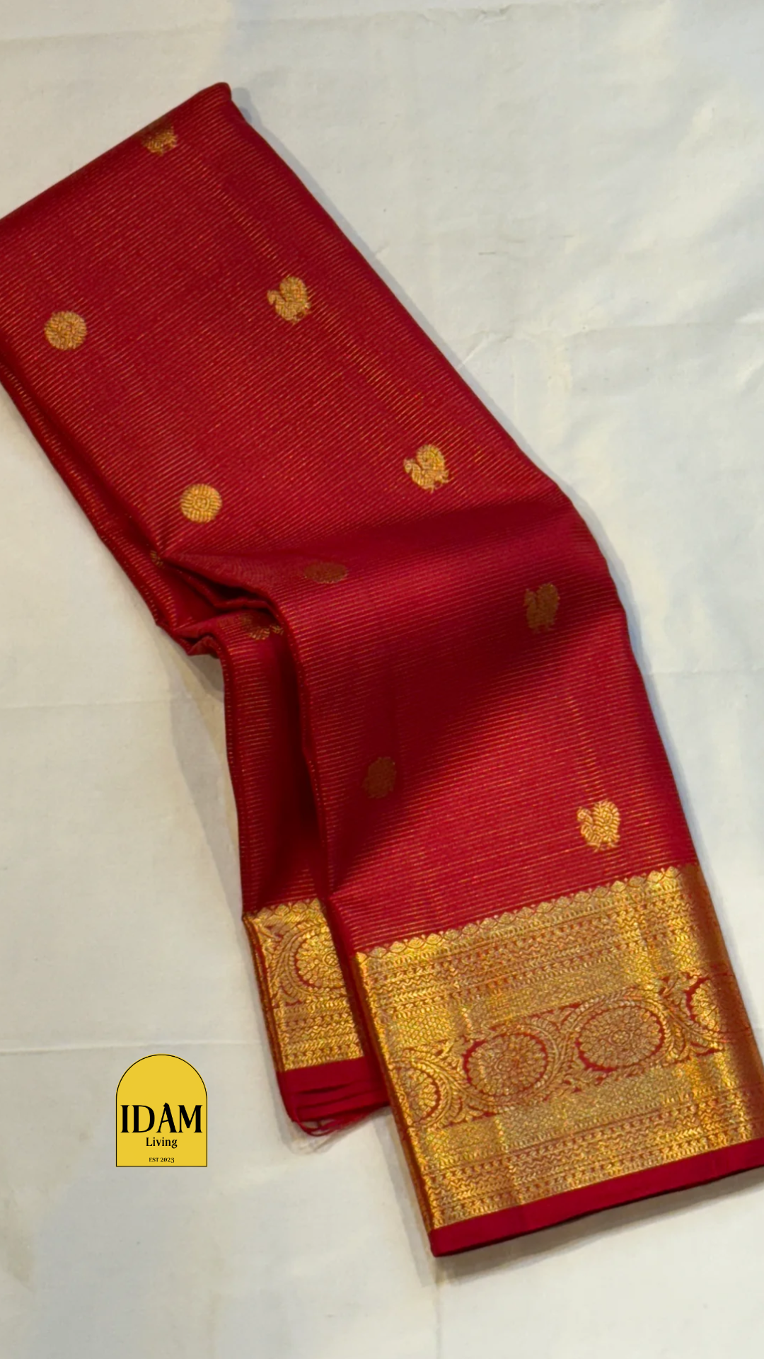 Nakshatra – Radiant Red Vairaoosi Kanchipuram Silk Saree Adorned with Mayil & Chakram Zari Buttas, Featuring an Ornate Kamalam and Floral Vine Zari Border, Flanked by Varisaipet Motifs, and a Pallu Woven with Sacred Thulasi Madams and Regal Kamalams