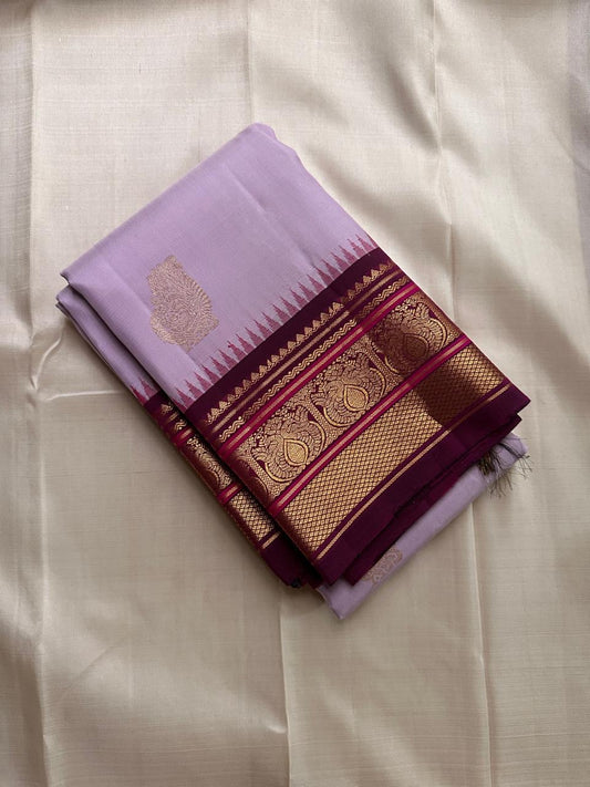 Lavanya Varnam — Pure Silk Kanchipuram Saree
Soft lavender-lilac body with rose-gold paisley buttas and deep wine-maroon korvai borders woven with temple motifs and rich zari.
Silk Mark Certified • Blouse Stitching Available ($30) • Free USA Shipping •