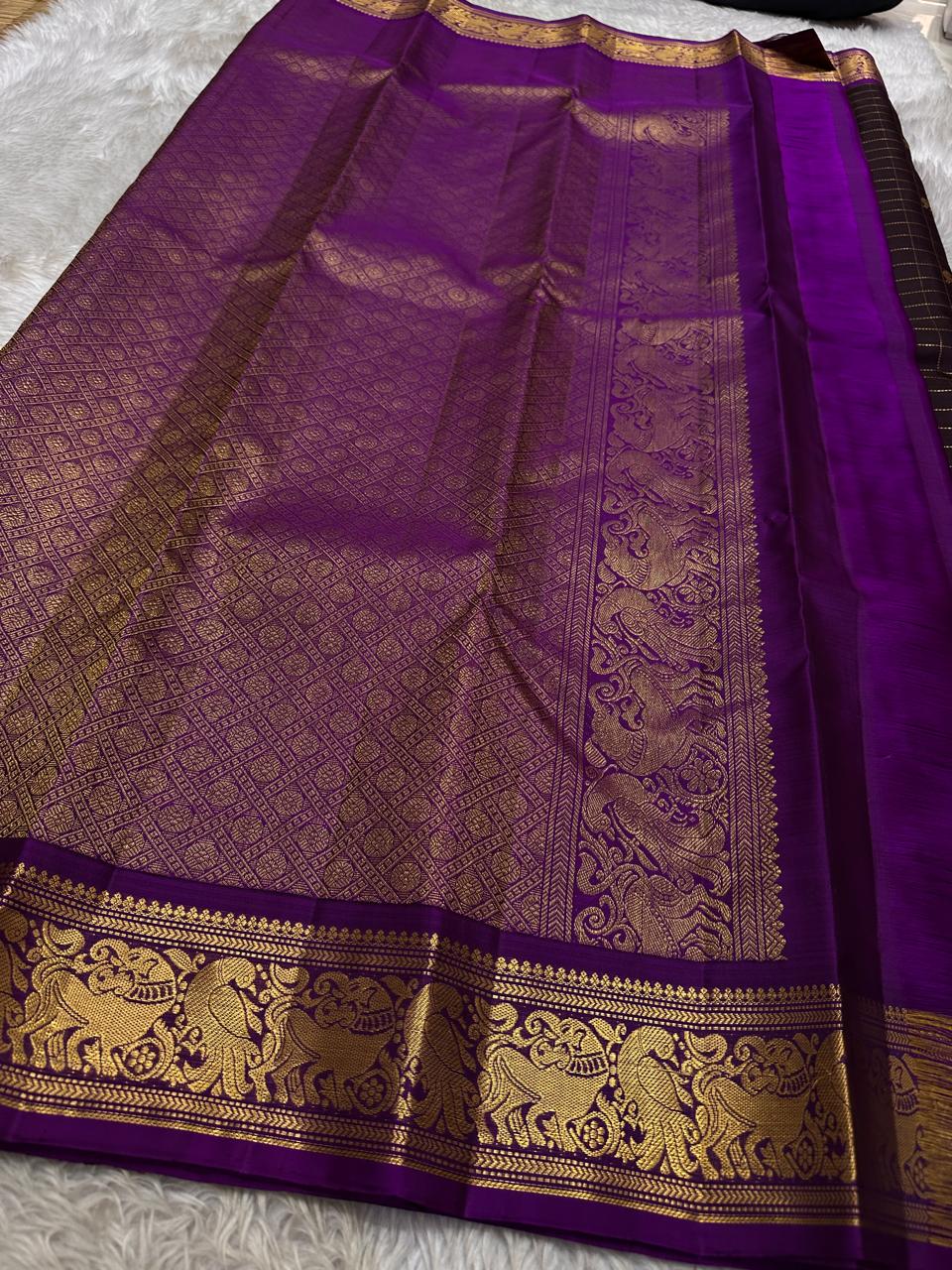 Sorgavaasal Kili , stunning motif in dark brown and purple zari kattam zari woven yazhi buttas in pure silk kanchipuram