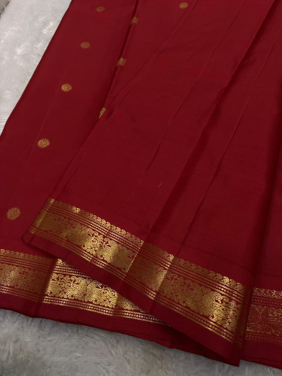 Ratna Rekha — Pure Silk Kanchipuram Saree
Deep kumkum red body with gold coin buttas, rich woven zari jaal pallu, and antique-gold floral borders.
Silk Mark Certified • Blouse Stitching ($30) • Free USA Shipping • Ships in 1 Week