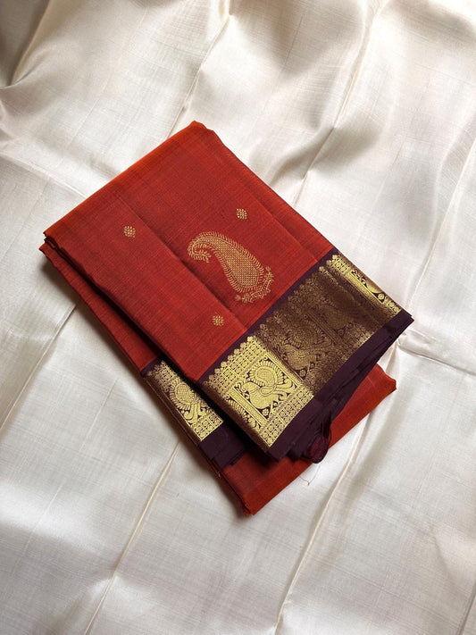 Tangerine rust orange   wirh deep chocolate  brown shot purple silk Kanchipuram saree with vanasringaram border and Pallu