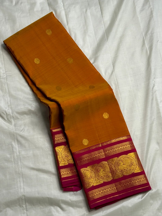 Rust Orange Pink Radiance — Pure Silk Kanchipuram
Earthy rust-orange body with gold coin buttas & rani pink korvai border in grand zari medallions
Silk Mark Certified • Free USA Shipping • Ships in Two Weeks ✅